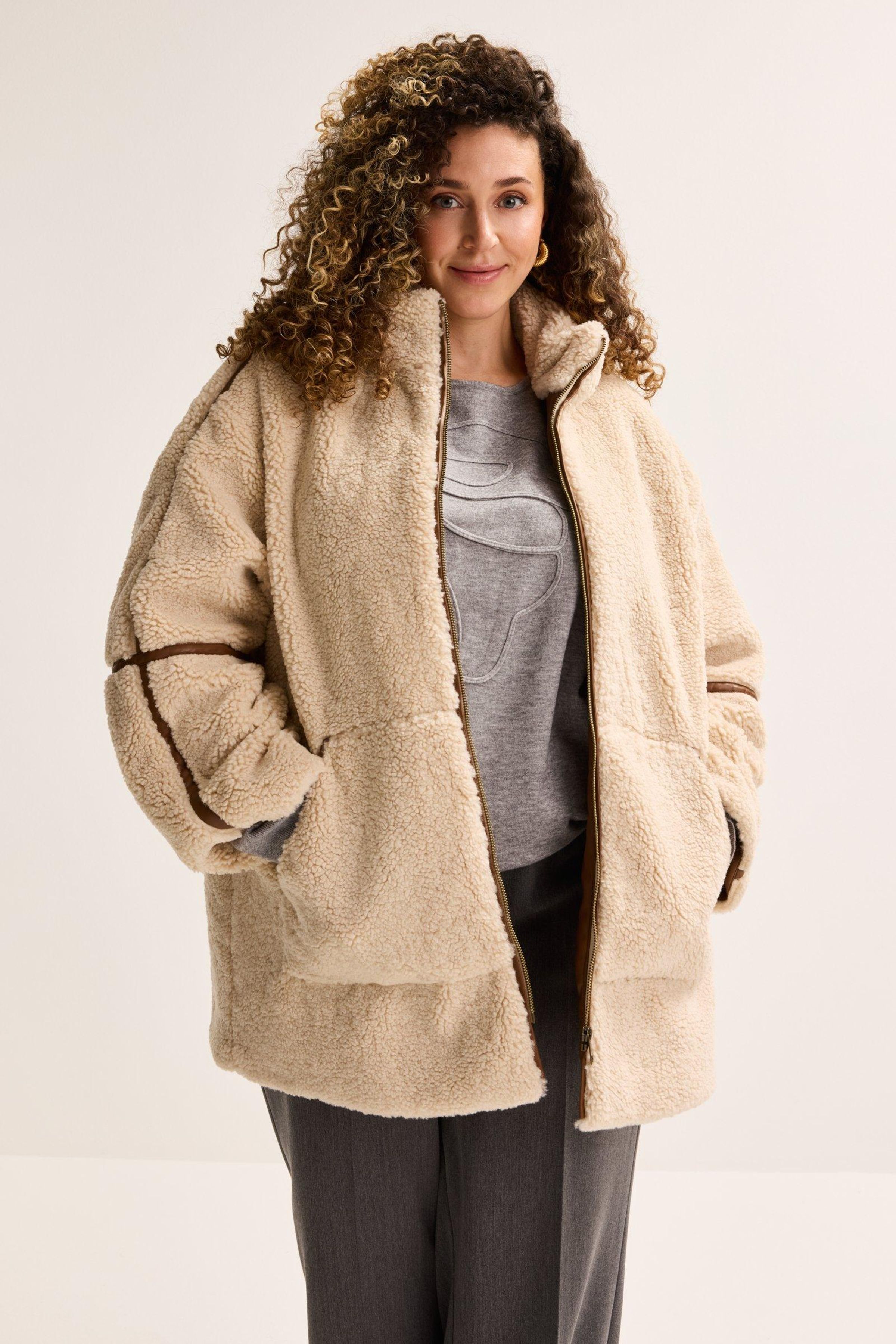 Jas in faux mouton retourn&eacute; - ame